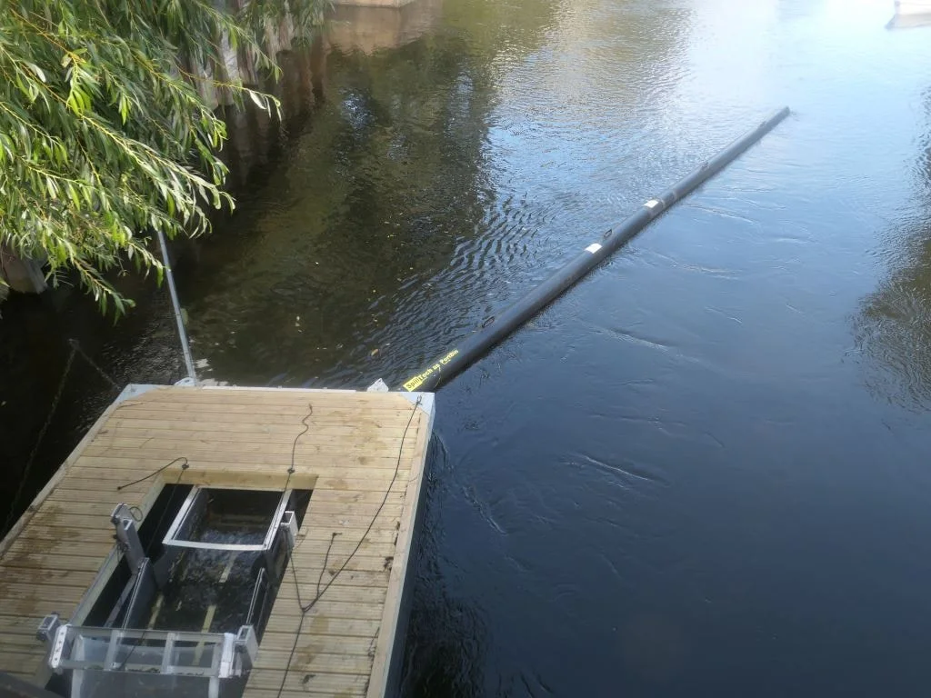 TrashTrawl with boom in a river